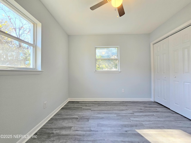 2434 Leonid Rd, Jacksonville, FL 32218 - unfurnished bedroom with hardwood / wood-style flooring, ceiling fan, and a closet