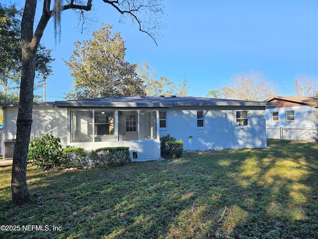 2434 Leonid Rd, Jacksonville, FL 32218 - view of front of house featuring a sunroom and a front yard