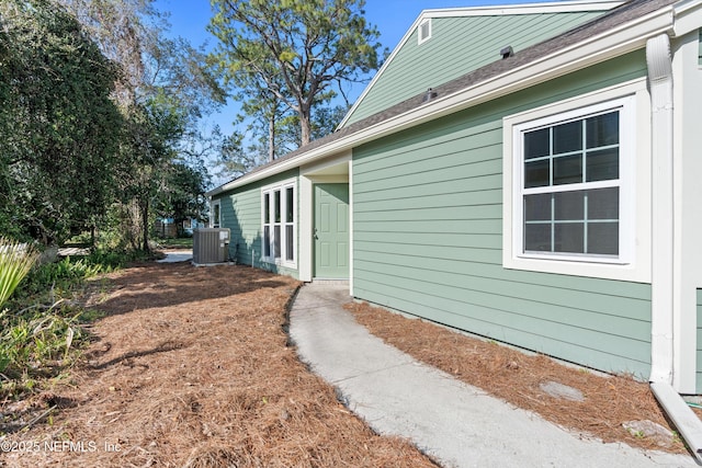 view of property exterior with central AC