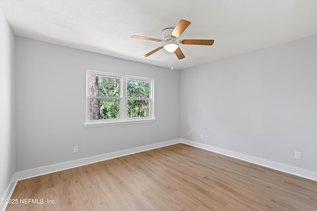 empty room featuring ceiling fan and light hardwood / wood-style floors