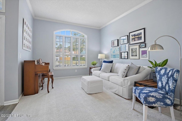 carpeted living area with a textured ceiling, ornamental molding, and baseboards