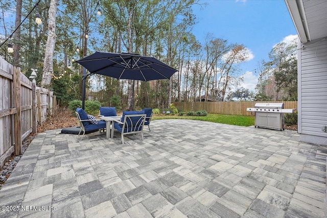 view of patio / terrace featuring grilling area and a fenced backyard