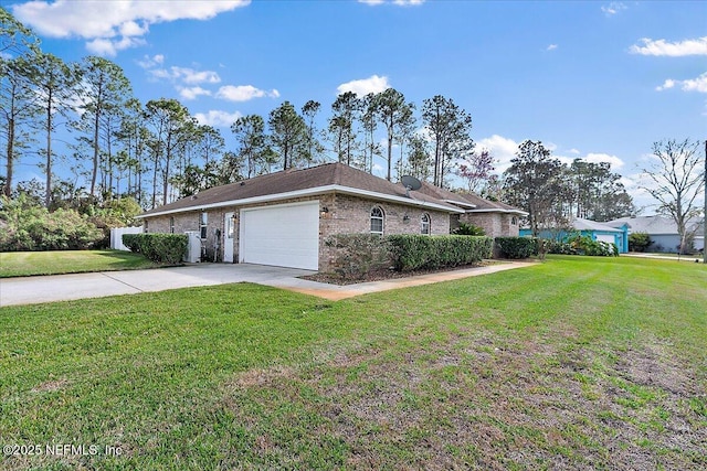 view of front of home with a garage and a front yard