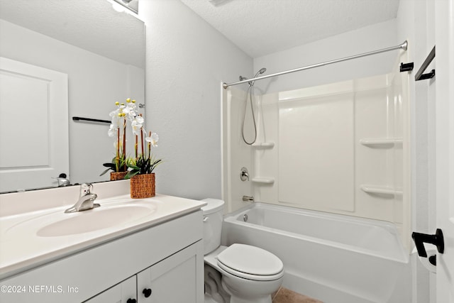 full bathroom featuring vanity, tub / shower combination, toilet, and a textured ceiling