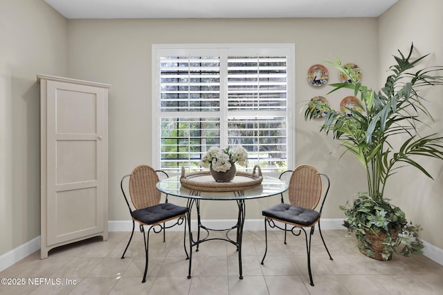 dining space with light tile patterned flooring