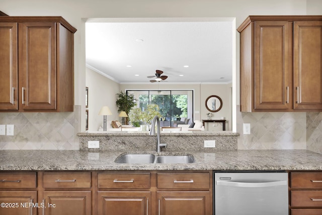 kitchen with sink, stainless steel dishwasher, ornamental molding, kitchen peninsula, and light stone countertops