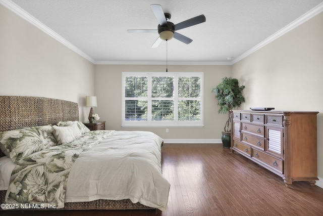 bedroom featuring dark wood-type flooring, ceiling fan, crown molding, and a textured ceiling