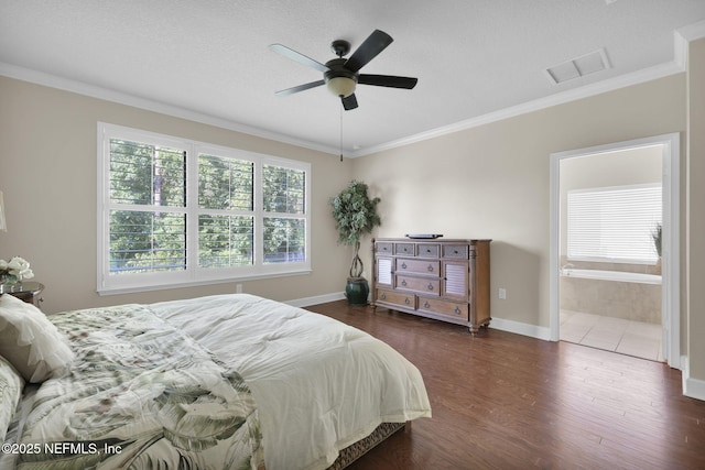 bedroom with multiple windows, crown molding, dark hardwood / wood-style floors, and ensuite bathroom