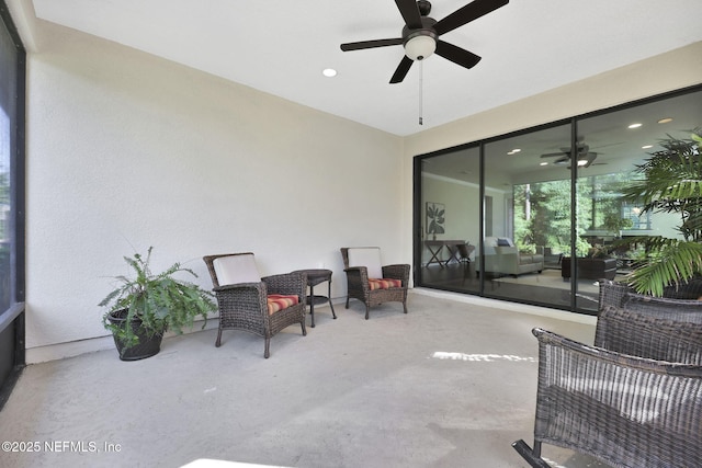 view of patio featuring ceiling fan