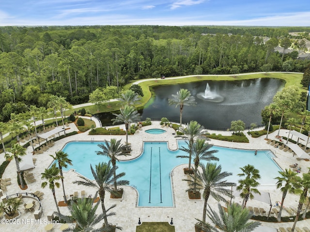 view of swimming pool with a hot tub, a water view, and a patio area