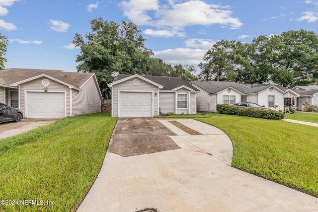 ranch-style house with a garage and a front yard