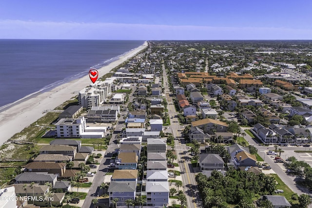 aerial view with a water view and a view of the beach