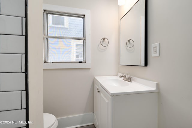 bathroom with vanity and toilet