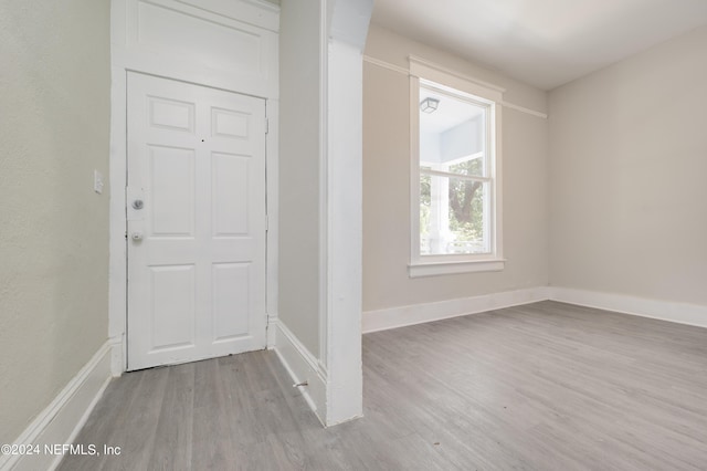 foyer entrance with light hardwood / wood-style flooring