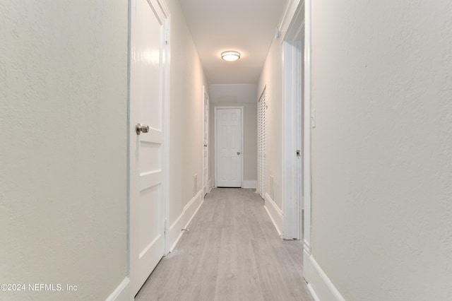 hallway featuring light wood-type flooring