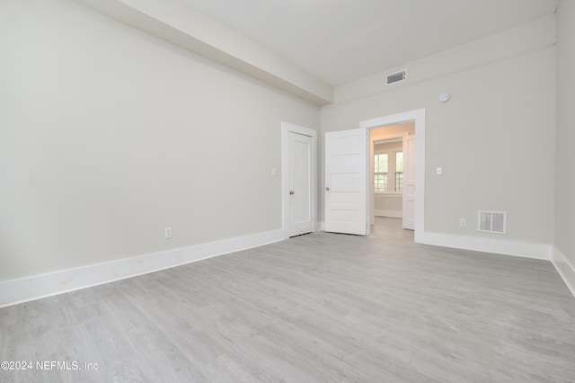 spare room with light hardwood / wood-style flooring