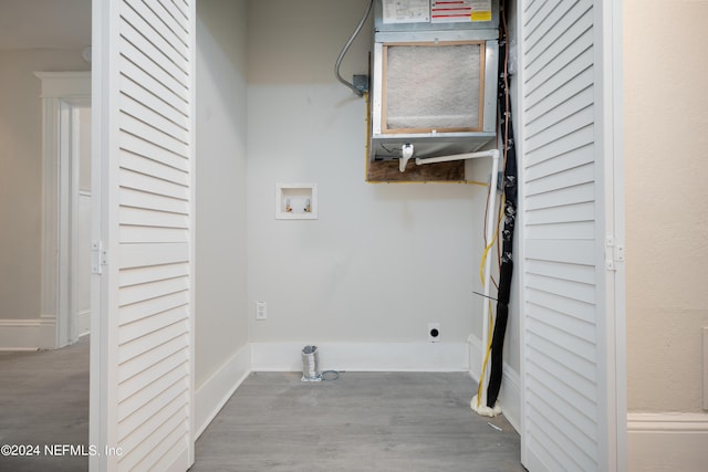 laundry room with washer hookup and light wood-type flooring