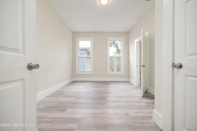 unfurnished room with light hardwood / wood-style flooring