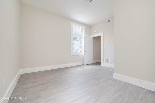 unfurnished room featuring light wood-type flooring