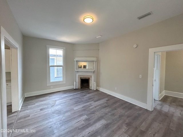 unfurnished living room featuring hardwood / wood-style floors