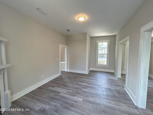 spare room with hardwood / wood-style floors