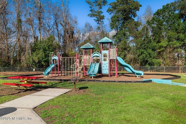 community playground with fence and a lawn