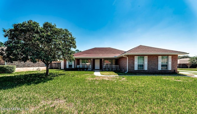 single story home with a front yard