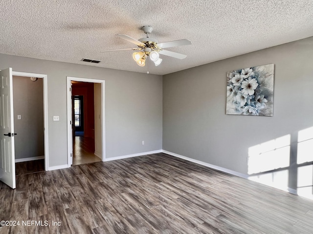 spare room featuring hardwood / wood-style floors, a textured ceiling, and ceiling fan