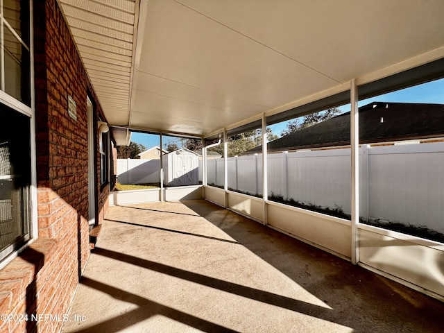 view of patio / terrace with a shed