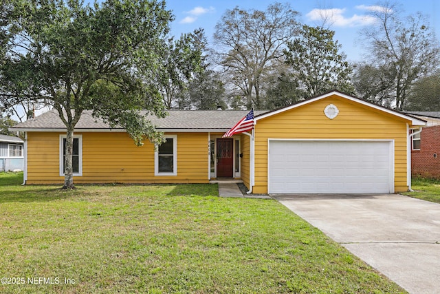 ranch-style house featuring a garage and a front lawn