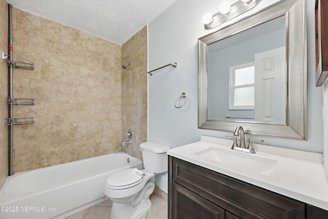 full bathroom featuring toilet, tiled shower / bath, a textured ceiling, vanity, and tile patterned flooring