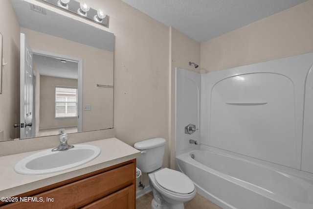 full bathroom featuring vanity, a textured ceiling, washtub / shower combination, and toilet