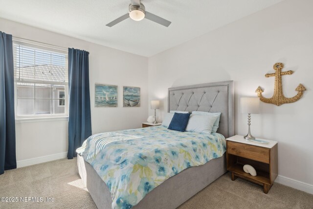 bedroom with baseboards, light carpet, and a ceiling fan