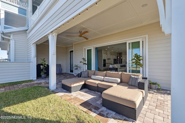 view of patio with outdoor lounge area and a ceiling fan