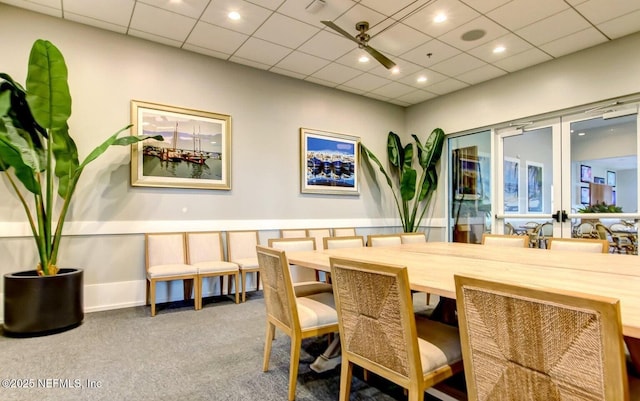 dining area with carpet, baseboards, french doors, and a paneled ceiling