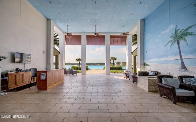 interior space featuring exterior kitchen and a water view