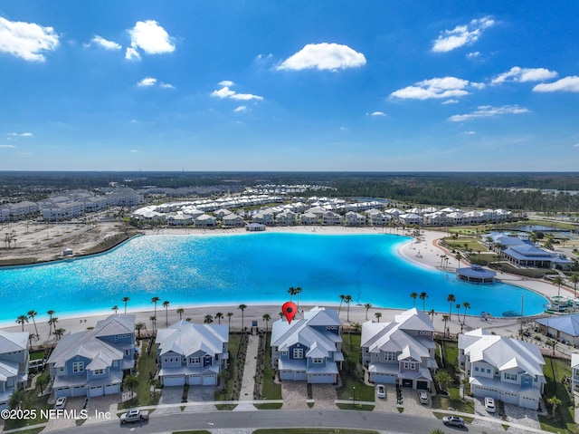 aerial view featuring a residential view and a water view