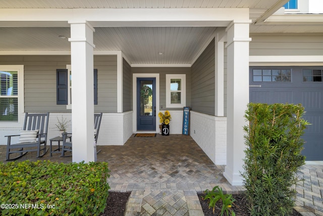 entrance to property with covered porch