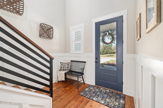 entryway with dark hardwood / wood-style flooring