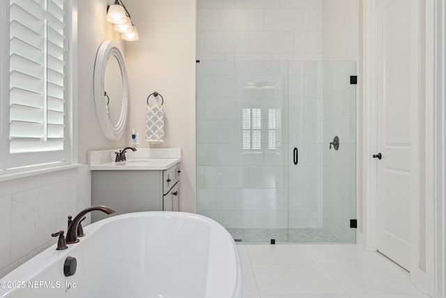 bathroom featuring tile patterned floors, vanity, and independent shower and bath