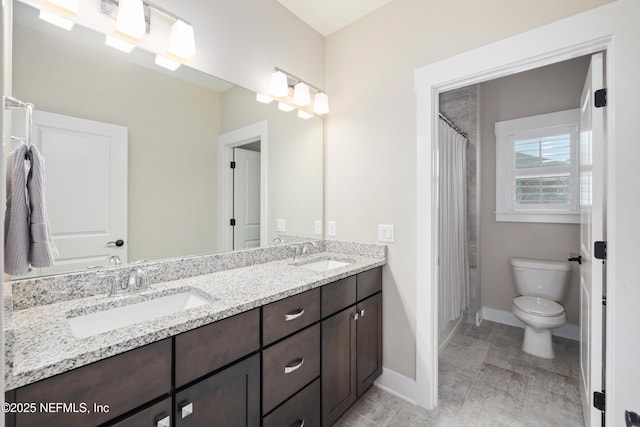 bathroom with vanity, toilet, and a shower with shower curtain