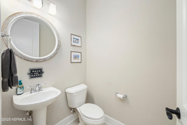 bathroom with toilet and sink