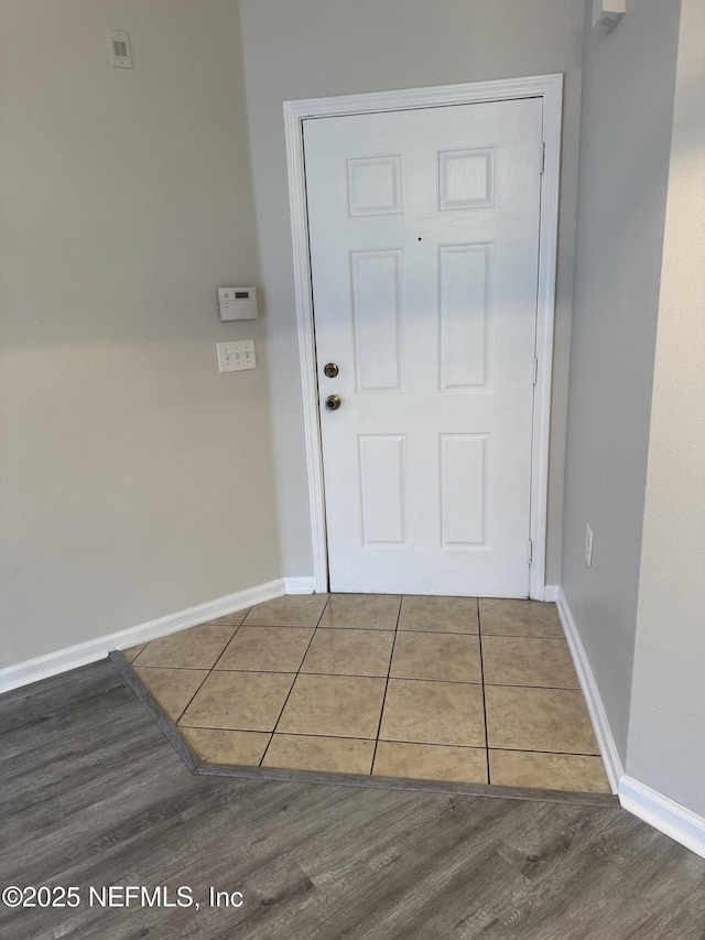 doorway to outside with hardwood / wood-style flooring