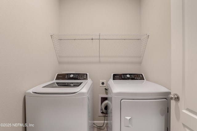 washroom with washer and dryer