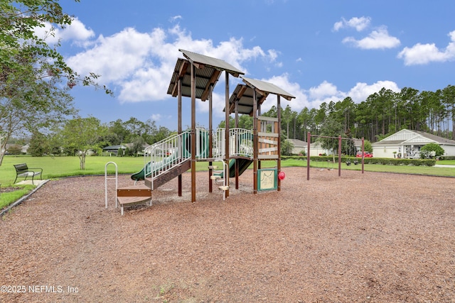 view of playground with a lawn