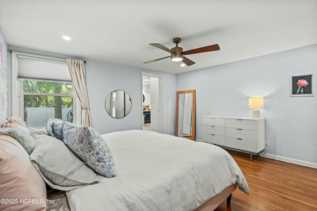 bedroom with hardwood / wood-style flooring and ceiling fan