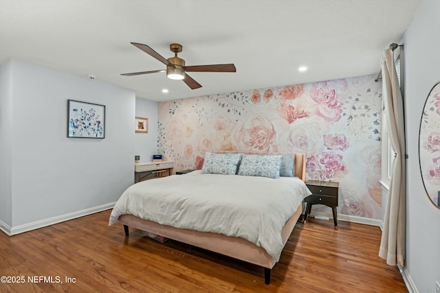 bedroom with hardwood / wood-style flooring and ceiling fan