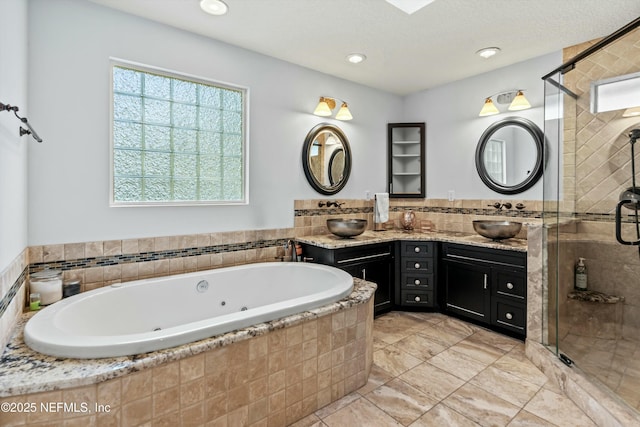 bathroom featuring vanity and shower with separate bathtub