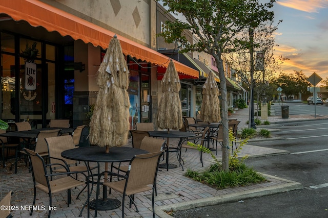 view of patio terrace at dusk