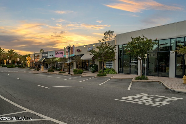 view of outdoor building at dusk